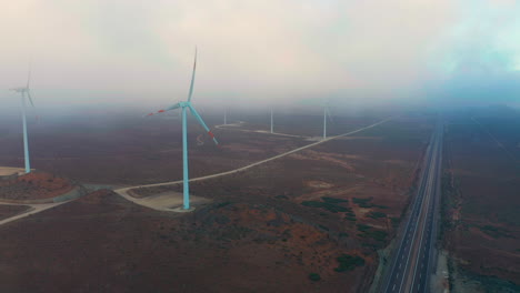 Luftaufnahme-Des-Windparks-Talinay-Am-Morgen-Mit-Wolken-In-Der-Luft-Bei-Ovalle,-Chile