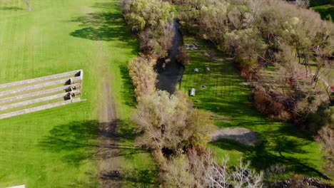 Aerial-drone-view-of-Michigan-park-and-creek-in-Autumn