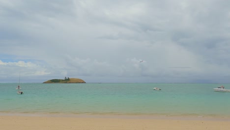 QantasLink-Dash-8-twin-propeller-commuter-aircraft-coming-into-land-over-the-lagoon-at-Lord-Howe-Island