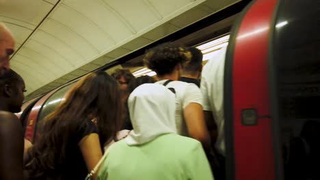 Bond-Street-Train-Station--London,-England---July-2022,-Passengers-Boarding-Train-London-Underground-Station