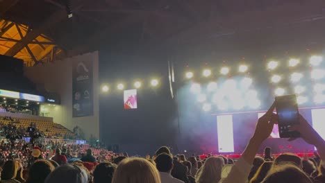 Fires-lighting,-flashes-blinking-and-smokes-coming-out-during-show-on-rock-concert