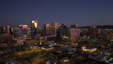 West-side-of-downtown-Phoenix,-evening-in-Arizona,-USA---pull-back,-drone-shot