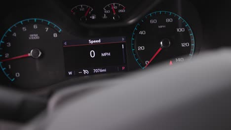 Chevrolet-emblem-on-the-steering-wheel-focus-shifts-to-the-dash-tachometer-revving-up-glowing-lights