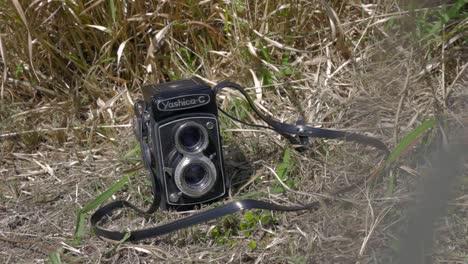 Still-shot-of-a-retro-vintage-Yashica-C-TLR-Camera-on-the-grass