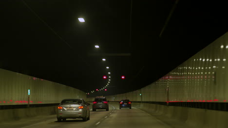 POV-car-Driving-through-a-long-tunnel,-Sydney-Australia