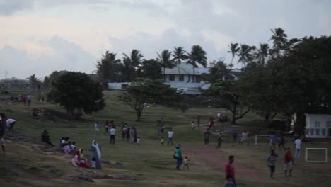 People-relaxing-and-kids-playing-in-Galle-fort-open-ground-area-in-the-evening