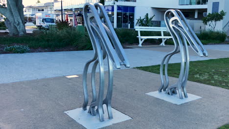 Twin-Pelican-bird-sculptures-at-Woody-Point-Jetty-on-a-cold-sunny-morning