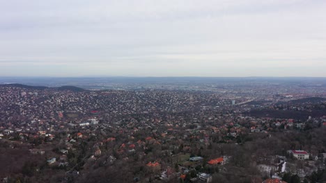 Drone-moves-fast-forward-and-closes-to-Budapest-the-capital-city-of-Hungary-in-a-cloudy-day-in-winter