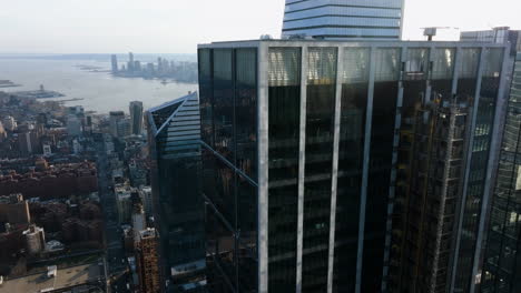 Ascending-aerial-view-in-front-of-55-and-30-Hudson-Yards-skyscrapers-in-NY