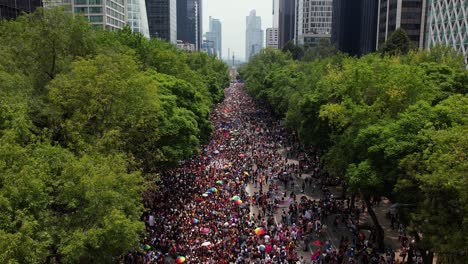 Massive-crowd-of-multi-ethnic-americans-taking-a-stand-for-Gay-Pride-In-Mexico-City---Aerial-Zoom-out