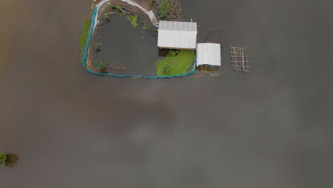 4k-Aerial-Top-Down-Reveal-shot-of-a-School-in-Majuli-river-island-submerged-in-the-Brahmaputra-Monsoon-floods