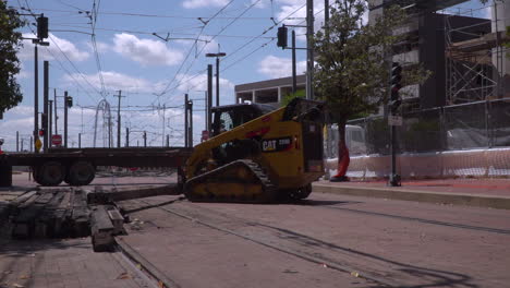 Heavy-machinery-tries-to-move-a-heavy-wooden-beam-on-to-a-flatbed