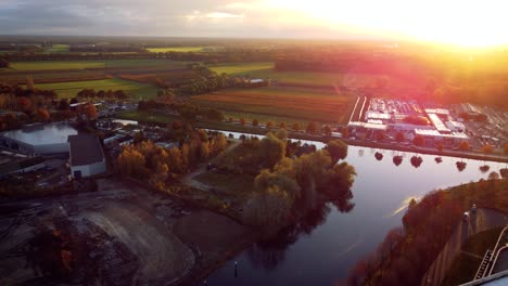 Fletcher-hotel,-Yuverta-school-on-Helmond-city-along-farm-filed-full-of-tulips-with-Sunset-in-the-background