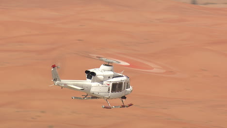 Close-shot-of-a-helicopter-over-the-desert