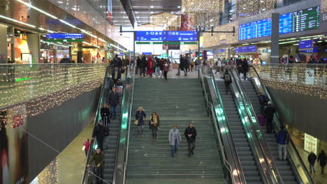 People-on-stairs-and-moving-stairs-on-the-main-train-station-of-Vienna,-Austria