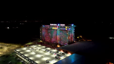 Wide-aerial-view-of-the-lit-up-Talking-Stick-Resort-building-during-twilight