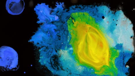 Vibrant-abstract-liquid-art-with-swirling-blue,-yellow,-and-green-colors-creating-a-cosmic-effect