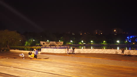 Drumul-Taberei,-Moghioros-Park-time-lapse-at-night-with-people-walking-Bucharest-Romania