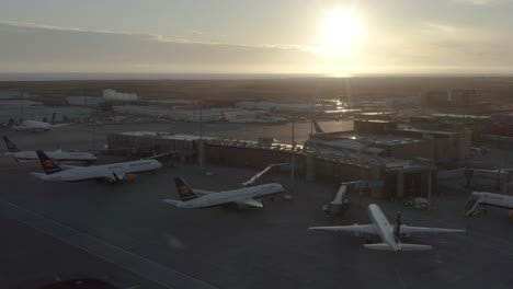 Cinematic-aerial-of-shut-down-international-Iceland-airport-with-parked-aircraft