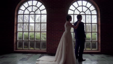 First-look-with-bride-and-groom-inside-the-church-foyer