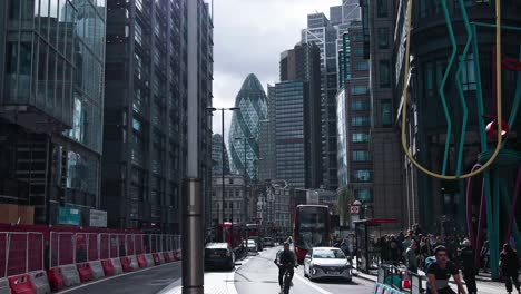 London,-England--September-29-2021:-Buses-and-cyclists-traffic-on-Liverpool-Street,-in-the-heart-of-the-financial-district-in-the-City-of-London,-near-Liverpool-street-train-station