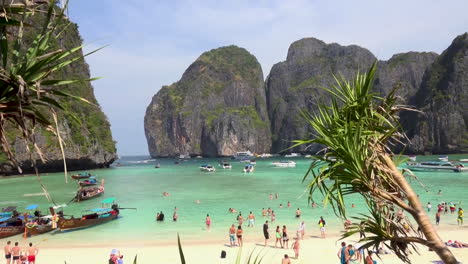 Tourists-enjoys-in-turquoise-water-in-lagoon-of-Maya-Bay-beach