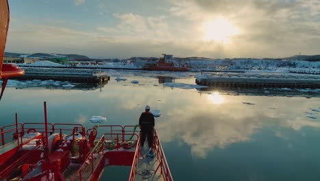 Sea-Mariner-Standing-On-Forward-Bow-Of-Garinko-II-Drift-Ice-Cruise-Ship-As-It-Approaches-Harbour-In-Mombetsu