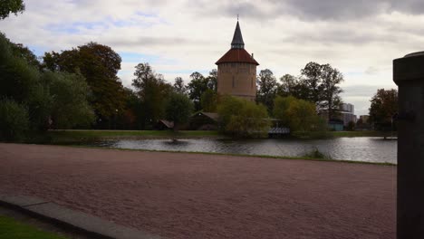 The-main-dam-with-the-old-water-tower-in-Pildammsparken,-Malmö,-Sweden