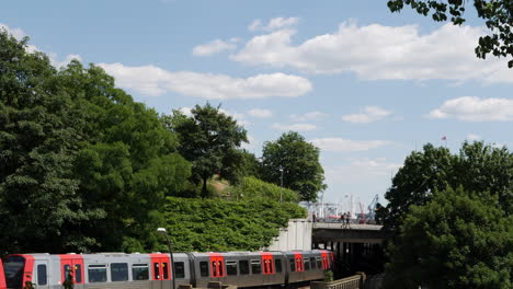 Train-leaves-subway-station-Landungsbruecken-in-Hamburg,-Germany-at-day