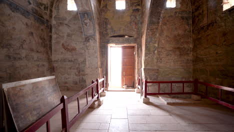 Interior-Halls-of-UNESCO-World-Heritage-Qasr-Amra-Desert-Castle-with-Dome-Ceiling,-Paintings-and-Wooden-Barriers