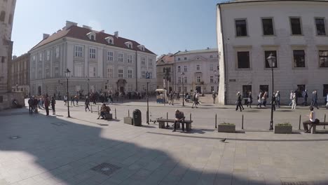 Daily-tourist-crowd-at-Krakow-old-town-square-Poland,-wide-panning-shot