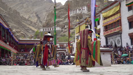 Monks-wearing-colorful-dresses-and-hats-dancing-at-Hemis-festival-in-monastery