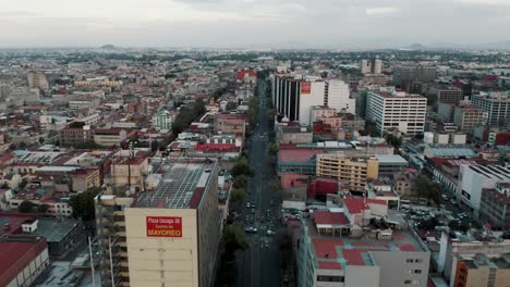 Aerial-View-Of-Streets-And-Buildings-In-Mexico-City-On-A-Cloudy-Day---drone-shot