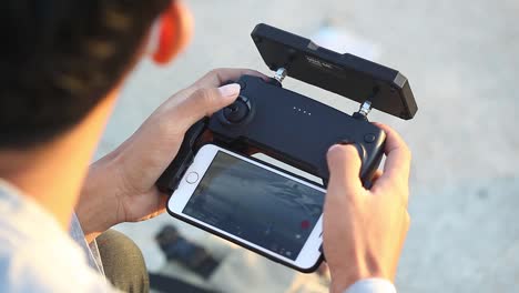 Close-up-of-a-hand-playing-the-drone-remote