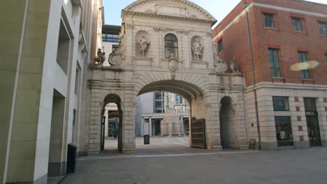 Lockdown-in-London,-deserted-Paternoster-Square-archway-in-beautiful-golden-hour-morning-sunrise-light,-during-the-Coronavirus-pandemic-2020