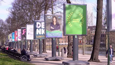 Billboards-displaying-the-participating-political-parties-during-the-upcoming-municipal-elections-near-the-Hofvijver-in-The-Hague,-Netherlands