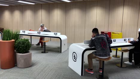 Travelers-recharging-their-cell-phones-and-portable-electronics-at-Toulouse-airport