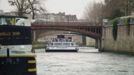 Christmas-river-boat-tour-on-Seine-river-with-tourists-taking-pictures-4k-60p