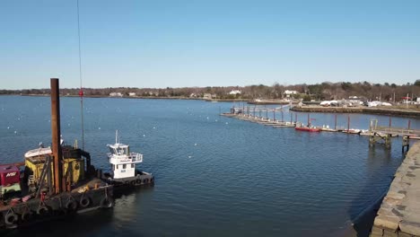 Low-aerial-shot-of-a-marine-area-with-crane-and-construction,-dry-and-wet-dock