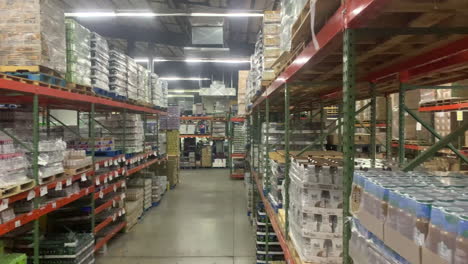 Piles-and-pallets-of-Soda-Soft-Drink-Products-in-Warehouse-Rows-and-Aisles,-4K