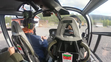 Two-male-helicopter-pilots-are-about-to-lift-off-to-the-big-mountain-Kebnekaise-in-Northern-Sweden