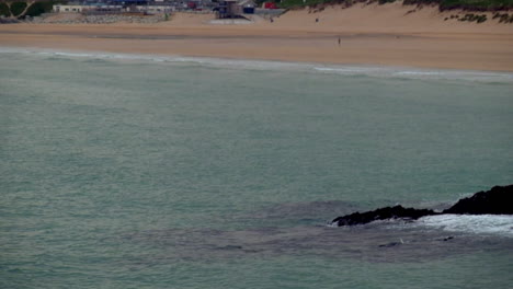 Tilt-shot-of-a-quiet-Fistral-beach-at-dawn