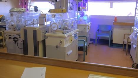 Newborn-babies-in-incubators-at-a-rural-African-hospital-ward,-tilt-up