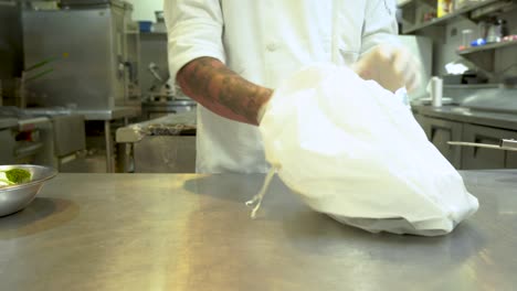 Hands-with-latex-gloves-putting-lunchbox-in-plastic-bag-for-delivery