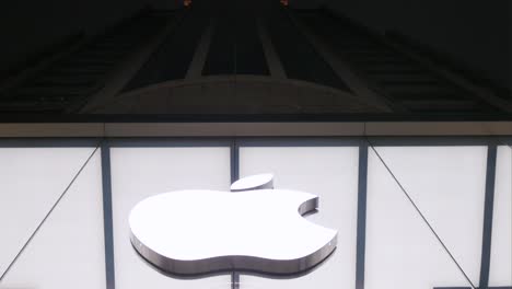 A-low-angle-shot-of-the-official-Apple-Store,-an-American-multinational-technology-company,-is-seen-at-nighttime-in-Hong-Kong