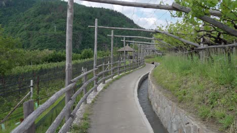 Part-of-the-irrigation-channel-hiking-path-in-Algund---Lagundo,-South-Tyrol,-Italy