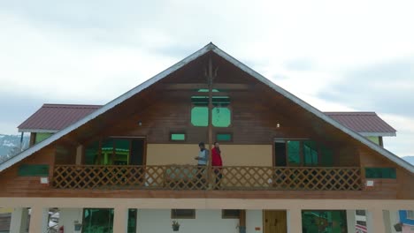 Backward-drone-shot-of-capturing-exterior-architecture-details-of-houses-at-Shogran-Valley-in-Pakistan