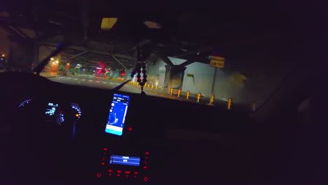 Tourist-rainy-night-drive-arriving-at-the-Beijing-Capital-airport,-China