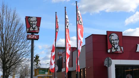 KFC-fast-food-restaurant-with-banners-waving-in-wind-in-slow-motion