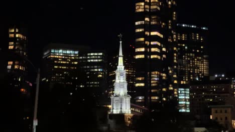 Panning-View-Across-Lit-Boston-Skyline-At-Night-With-Bright-Park-Street-Church-Roof